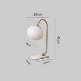 Bordlampe i metal og glas med marshmallow-form