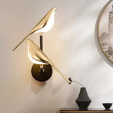 Moderne LED-væglampe i guld med fuglemotiv