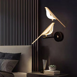 Moderne LED-væglampe i guld med fuglemotiv