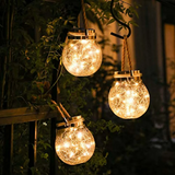 Havelampe i glas og rustfrit stål – solcellelampe til terrassen