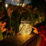 Havelampe i glas og rustfrit stål – solcellelampe til terrassen