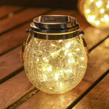 Havelampe i glas og rustfrit stål – solcellelampe til terrassen