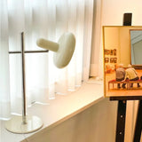 Bordlampe i hvidt glas med skiveform – moderne